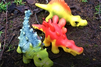 Toy dinosaurs outside