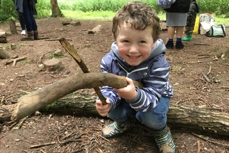 Nature Tot with sticks