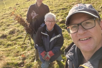 Planting trees as part of habitat creation on Newbold Comyn