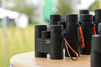 Opticron range of binoculars on stand