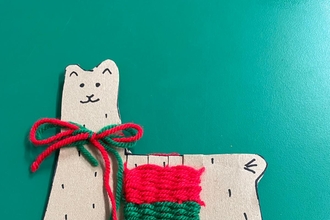 Lama Christmas decoration made from cardboard and woven wool scraps