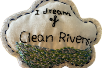 Embroidered Cloud with the words I dream of clean rivers