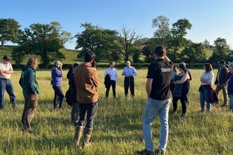 A group of farmers and landowners out on a walk with the Farm and Wildlife Advice Service from Warwickshire Wildlife Trust