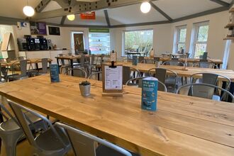 Photo of our Brandon Marsh cafe with chairs, tables, menus