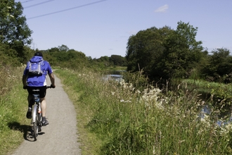 Cycling by a canal; Cumbernauld; sunny; afternoon; 24.07.2011 - Katrina Martin