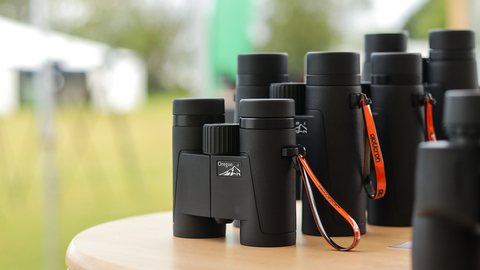 Opticron range of binoculars on stand