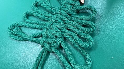 Green Macramé Christmas tree with a start at the top 