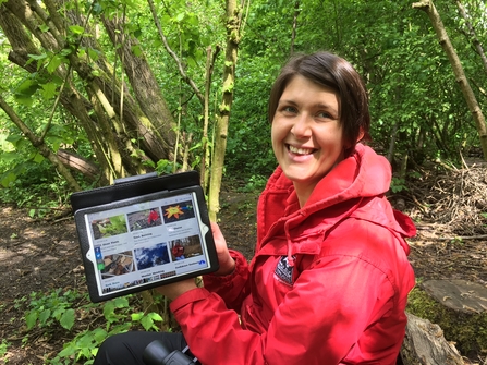 Education manager Vicky Dunne with online Wild About Learning hub on tablet
