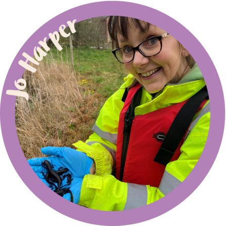 Biography photo of Jo our community organiser in Leamington holding a newt
