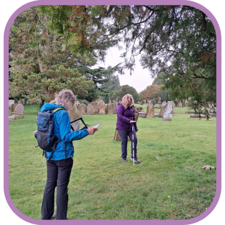 2 volunteers recording wildlife and recalibrating trail cameras for the National Hedgehog Monitoring Programme