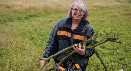 Volunteer helping wildlife on a Warwickshire Wildlife Trust reserve