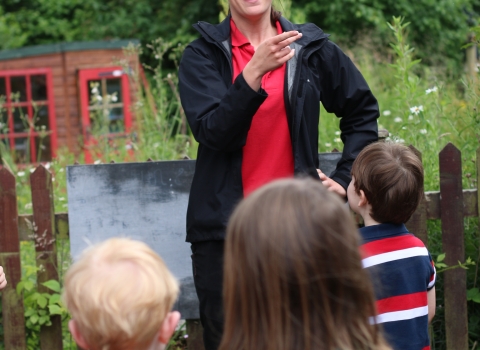 Education Officer Toni with children