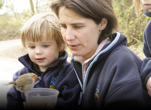 Nicholas Watts' daughter and grandson Vine House Farm feeding robin