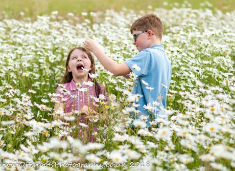 Children in meadow flowers Credit Vicky Page / Offshoots Photography